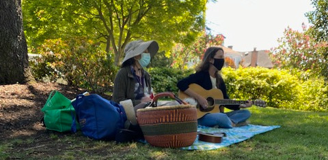 Nanci and Rebecca teaching a music class in the park